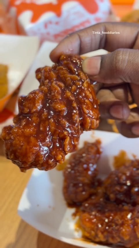 Instagram post by @tinta_fooddiaries for Popeyes. Caption reads: [...] officially here! 🍗🔥 Meet the all-new....