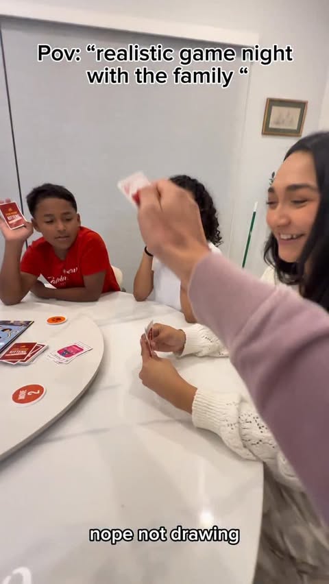 Instagram post by @ashleyannel for Exploding Kittens. Caption reads: Playing Exploding Kittens with our family! We had....