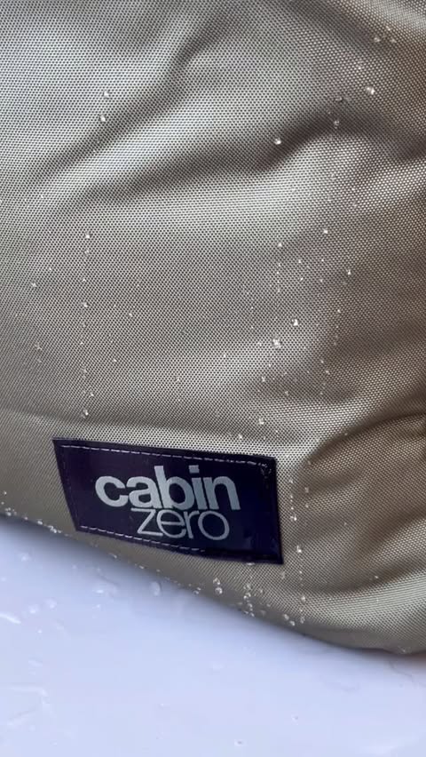 Instagram post by @contentbyheart_ for CABINZERO. Caption reads: [...] Classic Tech 28L backpack 🎒 Go to....