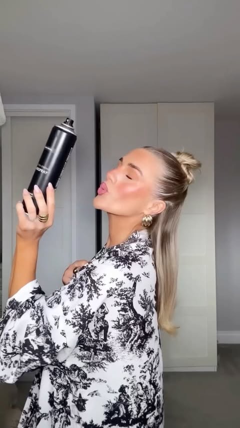 Instagram post by @chloephillips_sw for John Frieda. Caption reads: ad My festive sleek half-up is well and truly....