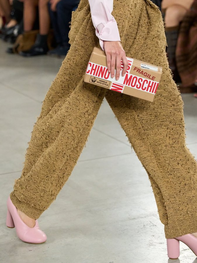 Instagram post by @archivedrunway for Moschino. Caption reads: Moschino SS26 embraces playful absurdity with....