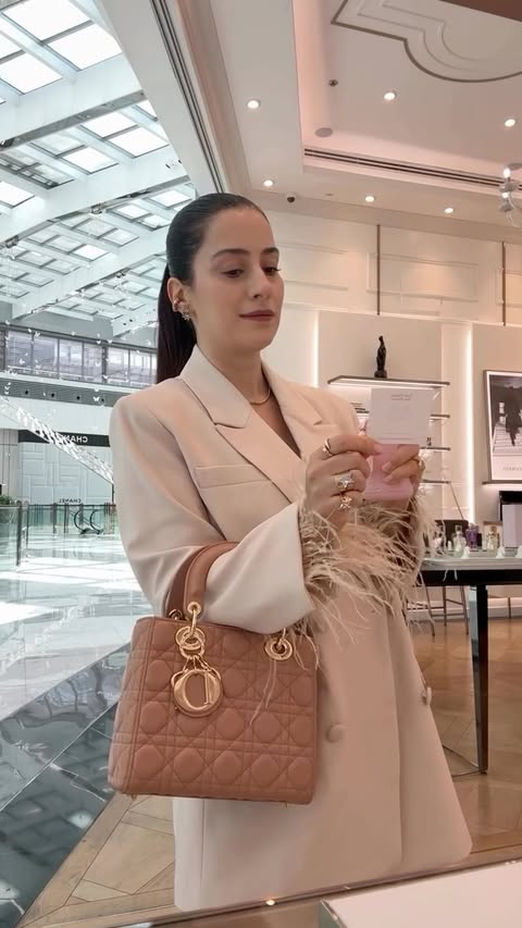 Instagram post by @dreamydubaidiary for PARFUMS de MARLY. Caption reads: [...] signature scent? 🌸 Delina by....