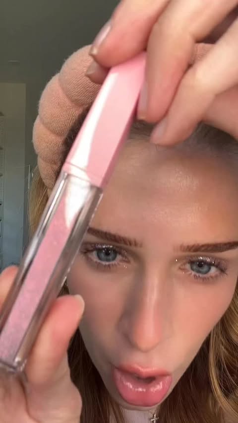 Instagram post by @sarah_wolak for KimChi Chic Beauty. Caption reads: Trying the sparkliest #lipgloss of all time!!!.