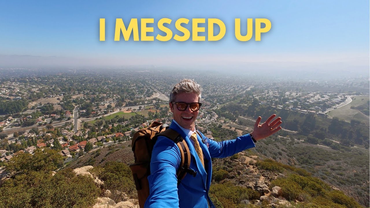 YouTube post by @ParkerYorkSmith for GRAMS28. Caption reads: Climbing a Mountain in a Suit (things went very....