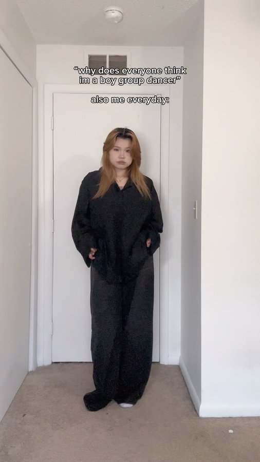 Instagram post by @yyxuanii for Emmiol. Caption reads: black pants + a oversized top >> pants:....