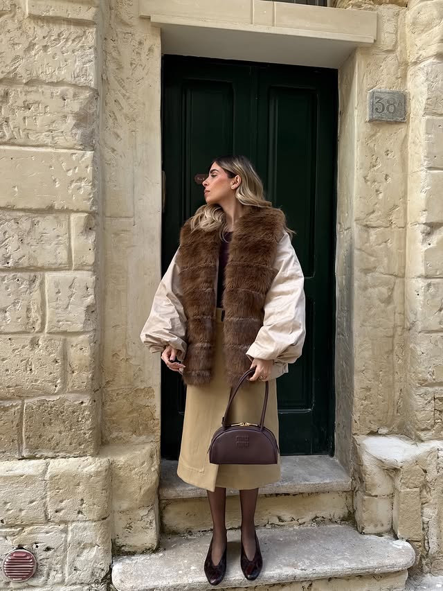 Instagram post by an influencer for Mytheresa. Caption reads: [...] The most viral coat found on @mytheresa.com....