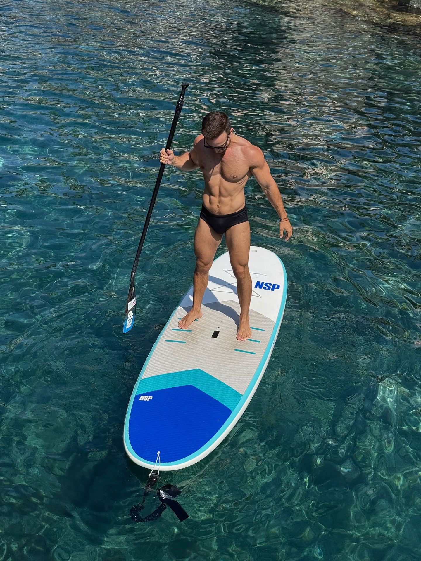 Instagram post by @davidescri for The Gay Passport. Caption reads: Ocean views, morning SUP yoga, chill swims and....