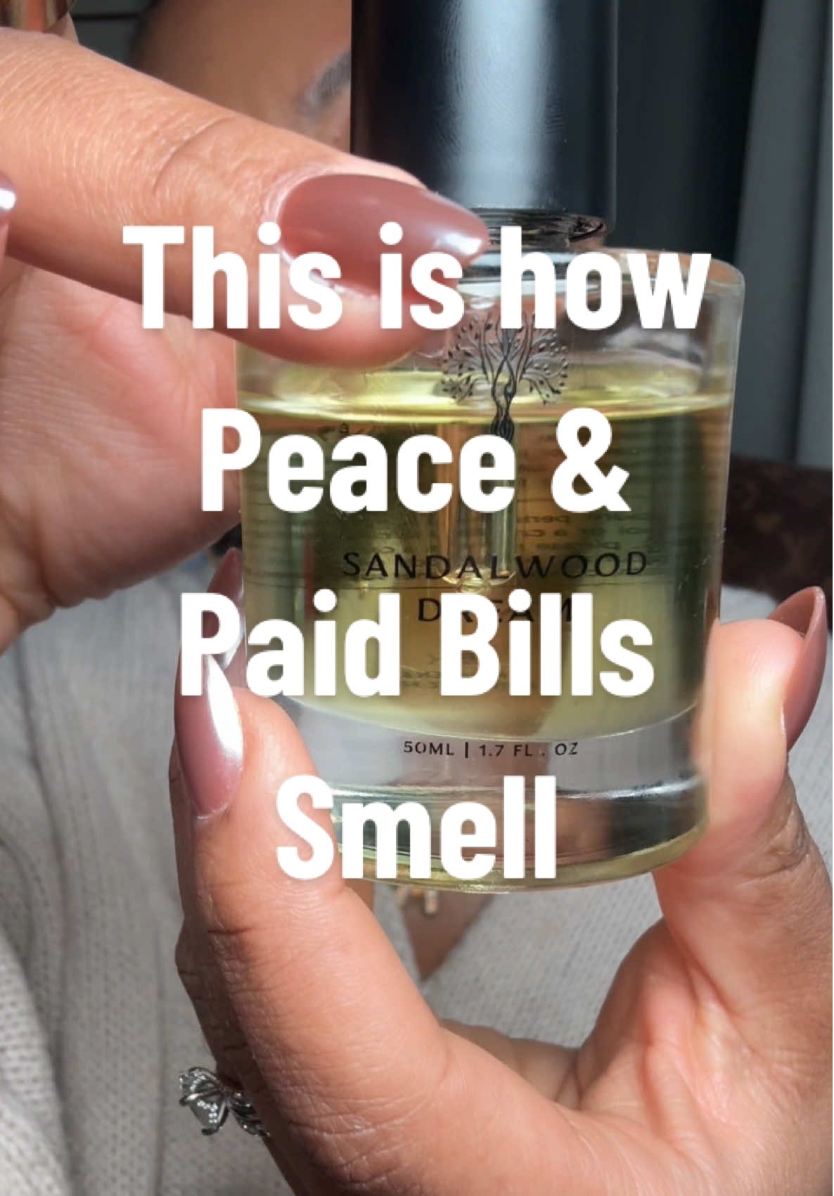 TikTok post by @suki_michelle_ for Eternal Perfume Oils. Caption reads: @Eternal Perfume Oils Sandalwood Dreams smells....