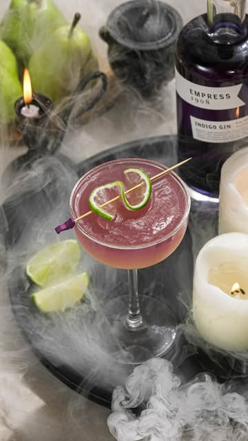 Instagram post by @the.boozy.ginger for Empress 1908 Gin. Caption reads: [...] with this Witches Brew Gimlet.....