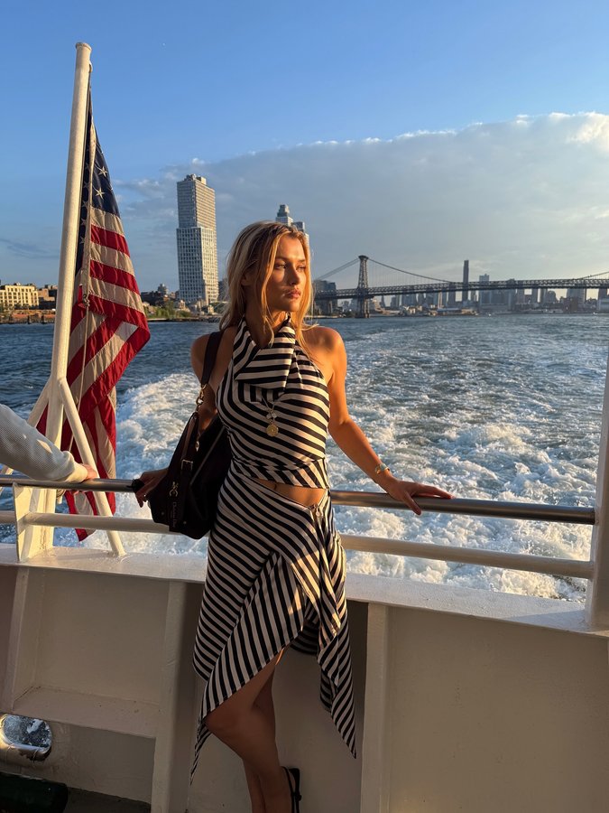 Instagram post by @chloelecareux for Lioness Fashion. Caption reads: Cruising around NYC 🚤 What’s your favorite thing....