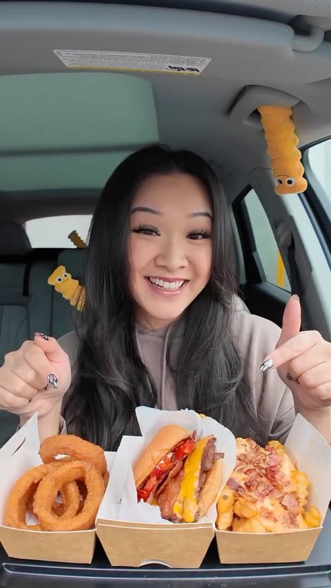 Instagram post by @trinhdoesthings for Shake Shack. Caption reads: Use code SHACKCHEER for a FREE SmokeShack with a....
