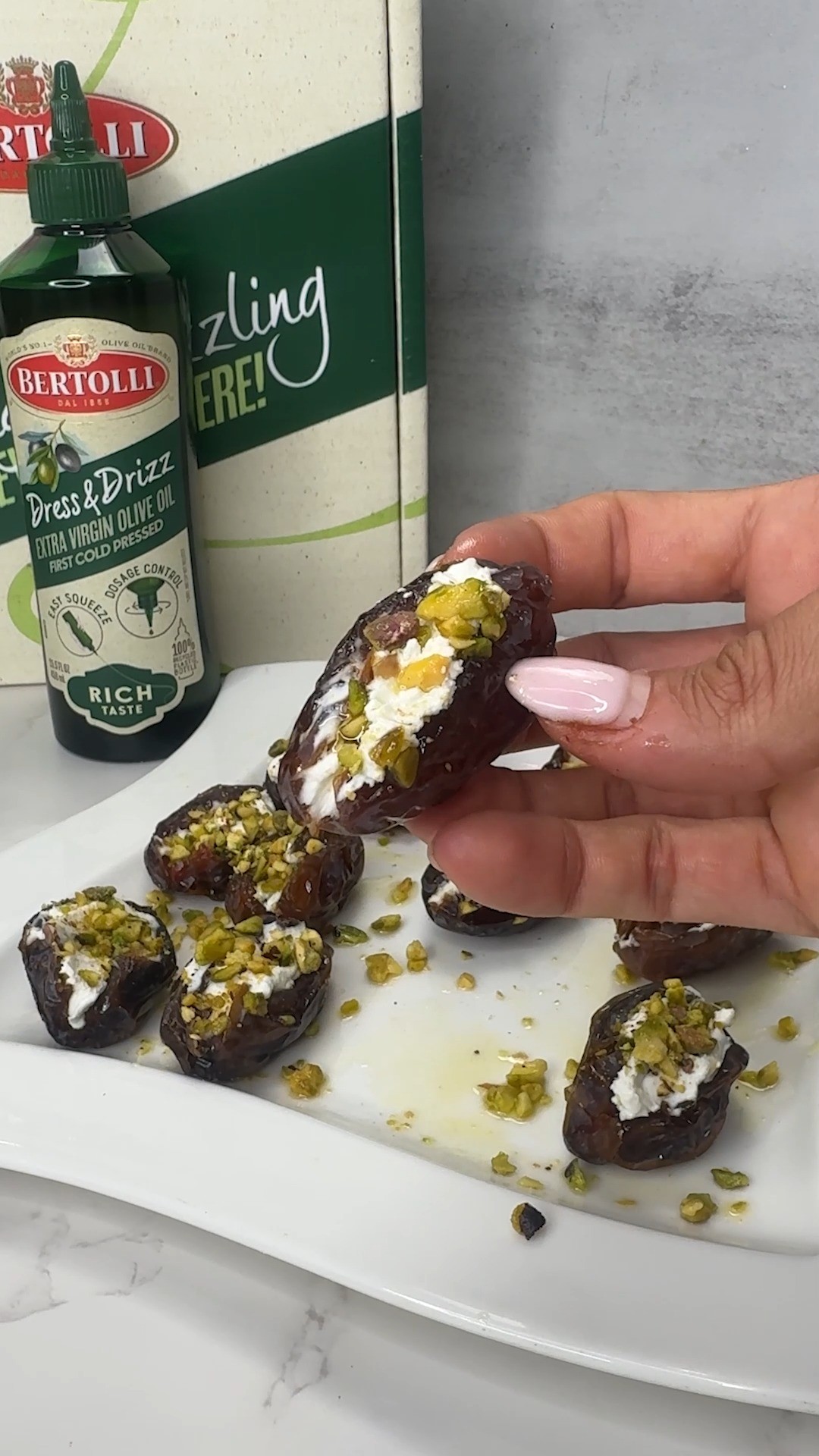 Instagram post by @wellnessfromwithinrd for Bertolli. Caption reads: The stuffed date combo you didn’t know you needed....