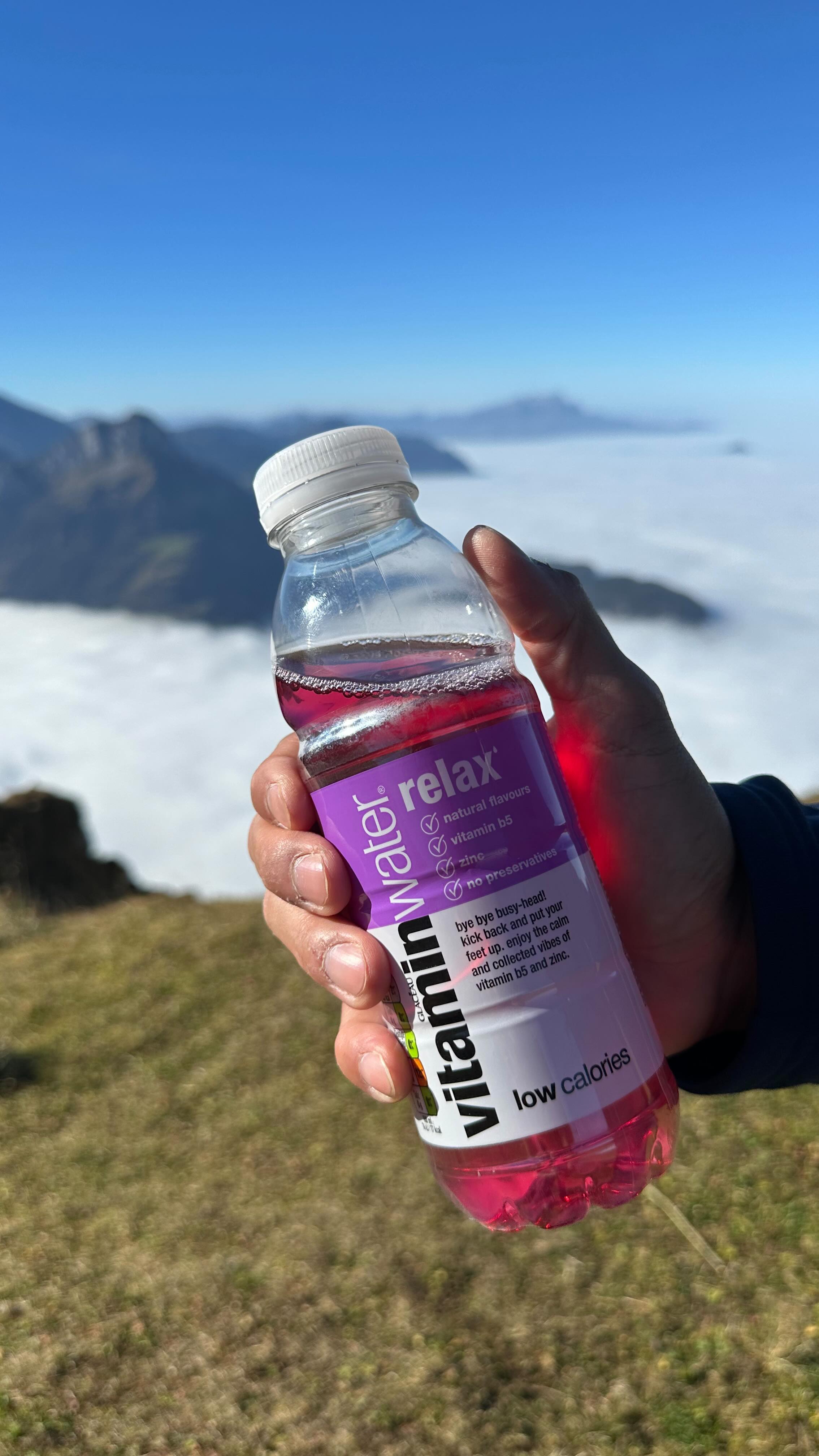 Instagram post by @albernsultan for vitaminwater. Caption reads: Ending summer with a peaceful hike in the Swiss....