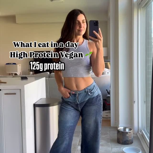 Instagram post by @that.veganbabe for PBfit. Caption reads: What I Eat in a Day as a Vegan eating 125g of....