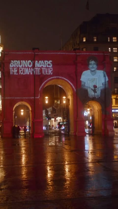 Instagram post by @brabrunomars for Live Nation. Caption reads: Out of home projection with @livenation 🌹 The....