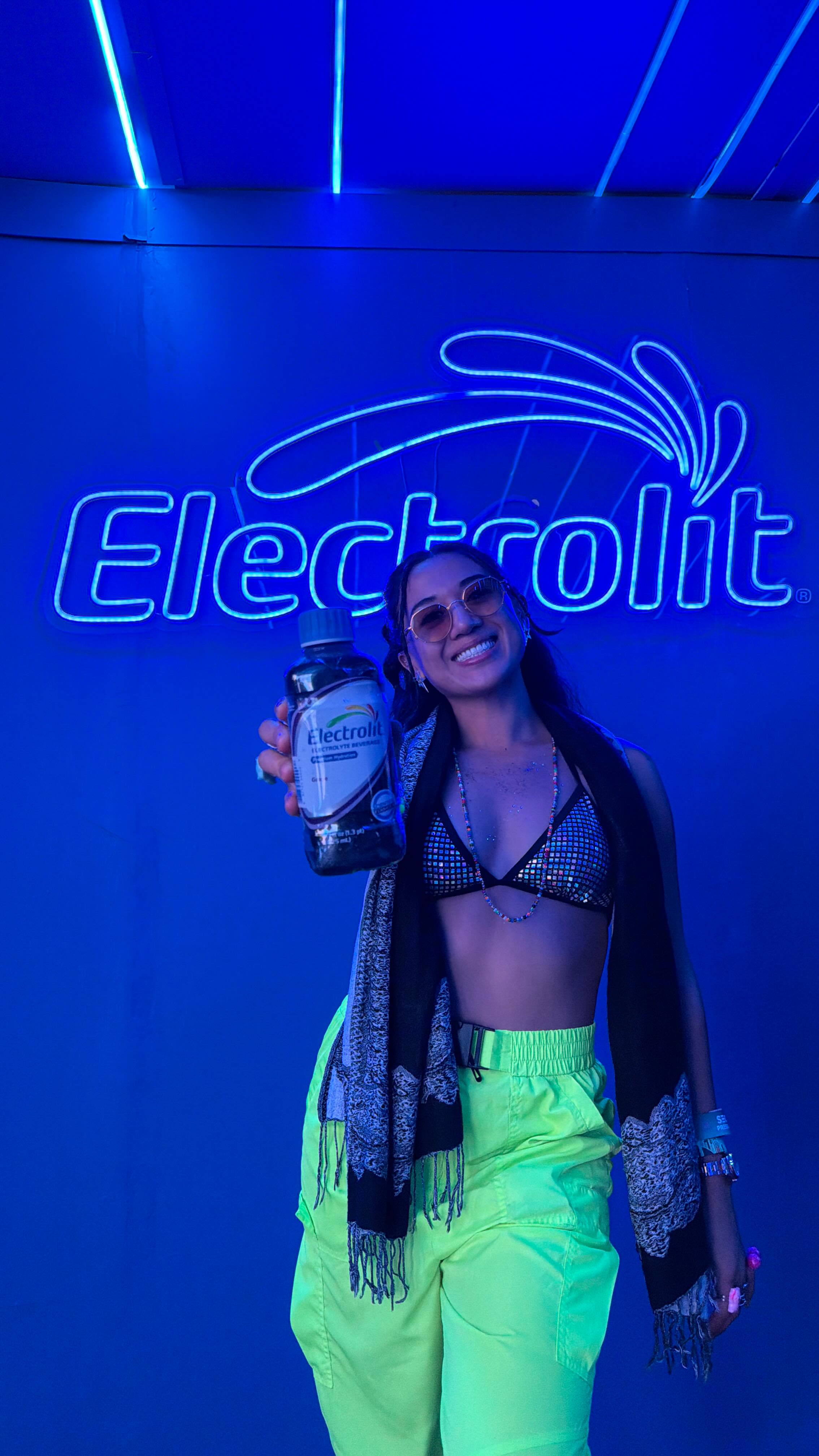 Instagram post by @explorewithgg for Electrolit. Caption reads: One of my top tips for EDC Orlando or any festival....