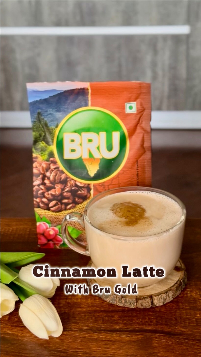 Instagram post by @the.food.talks for Bru Coffee India. Caption reads: Real Hug in a mug - Cinnamon Latte powered by Bru....