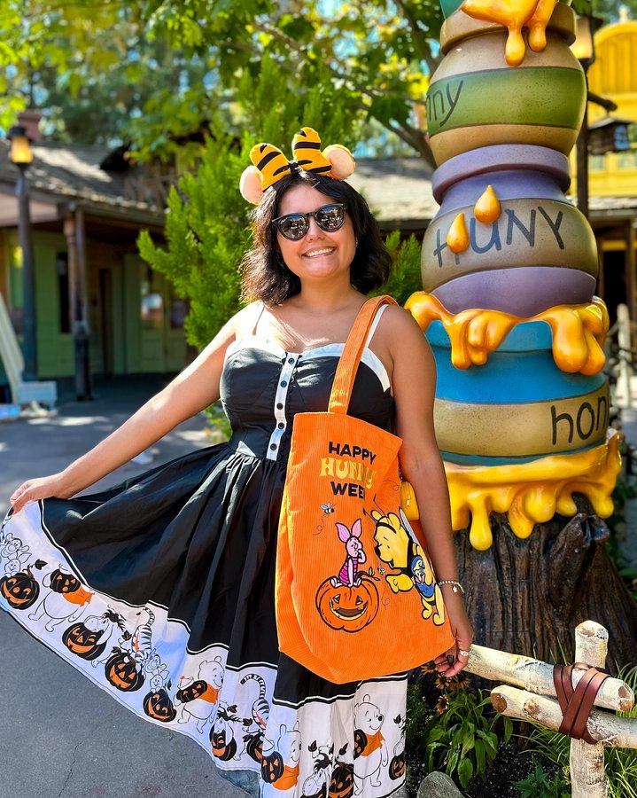 Instagram post by @thekatadventure for Unique Vintage. Caption reads: [...] Winnie the Pooh-inspired dress from....