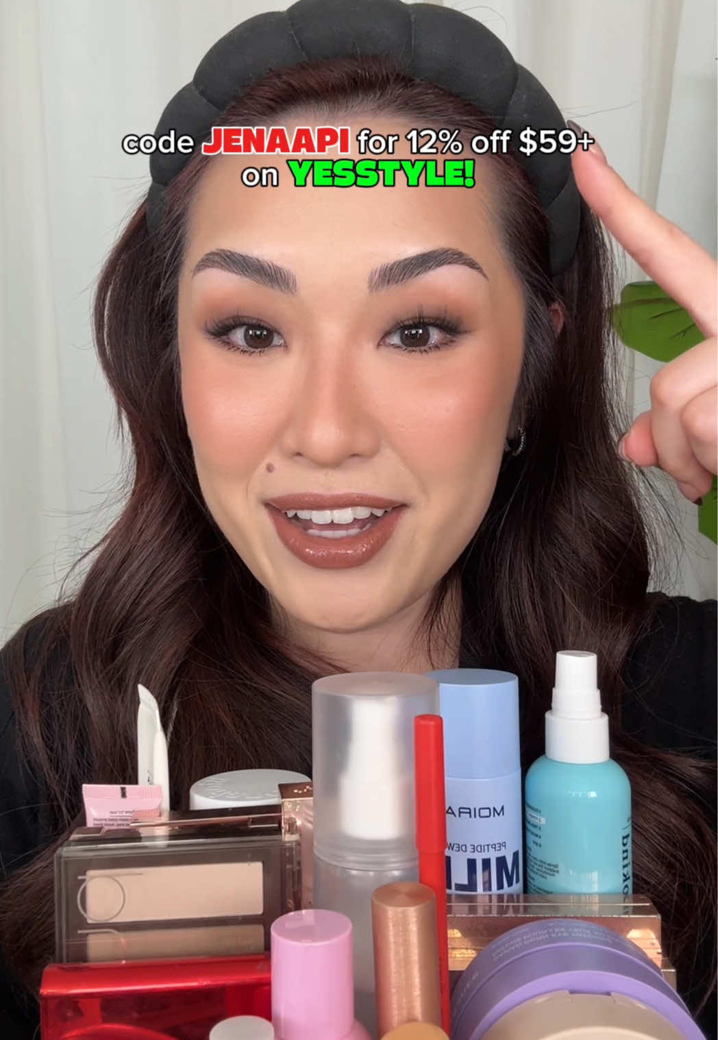 TikTok post by @greeneggsandglam for EM Cosmetics. Caption reads: [...] han all fix mascara, glasting balm @EM....
