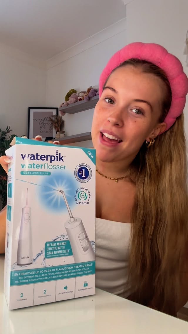 Instagram post by @_maisiemarsh_ for Waterpik Oral Health. Caption reads: Grab yours @waterpikuk 💙 #ad.