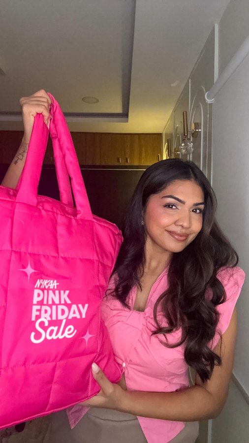 Instagram post by @akankshakommirelly for Nykaa. Caption reads: Pink Friday haul > everything. Must-haves only....