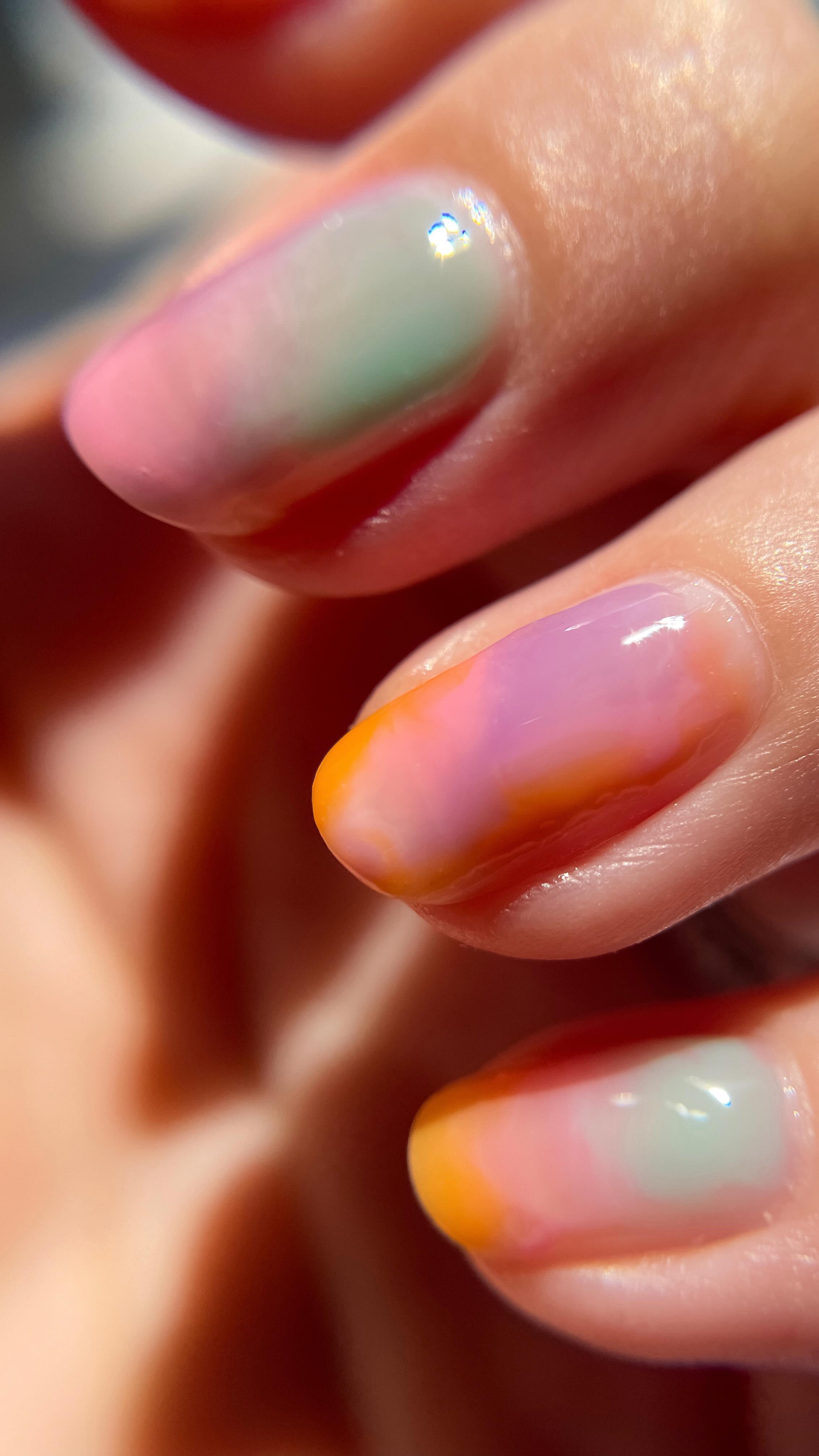 Instagram post by @nail.betch for Cirque Colors. Caption reads: Jelly tie-dye nails using regular polish as always....