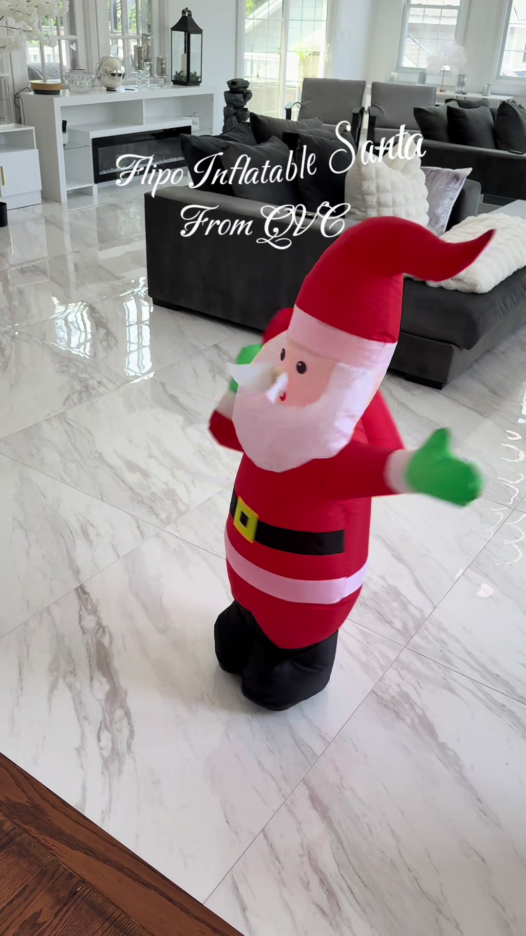TikTok post by an influencer for QVC. Caption reads: [...] Controlled Inflatable Santa @QVC, Inc #santa....