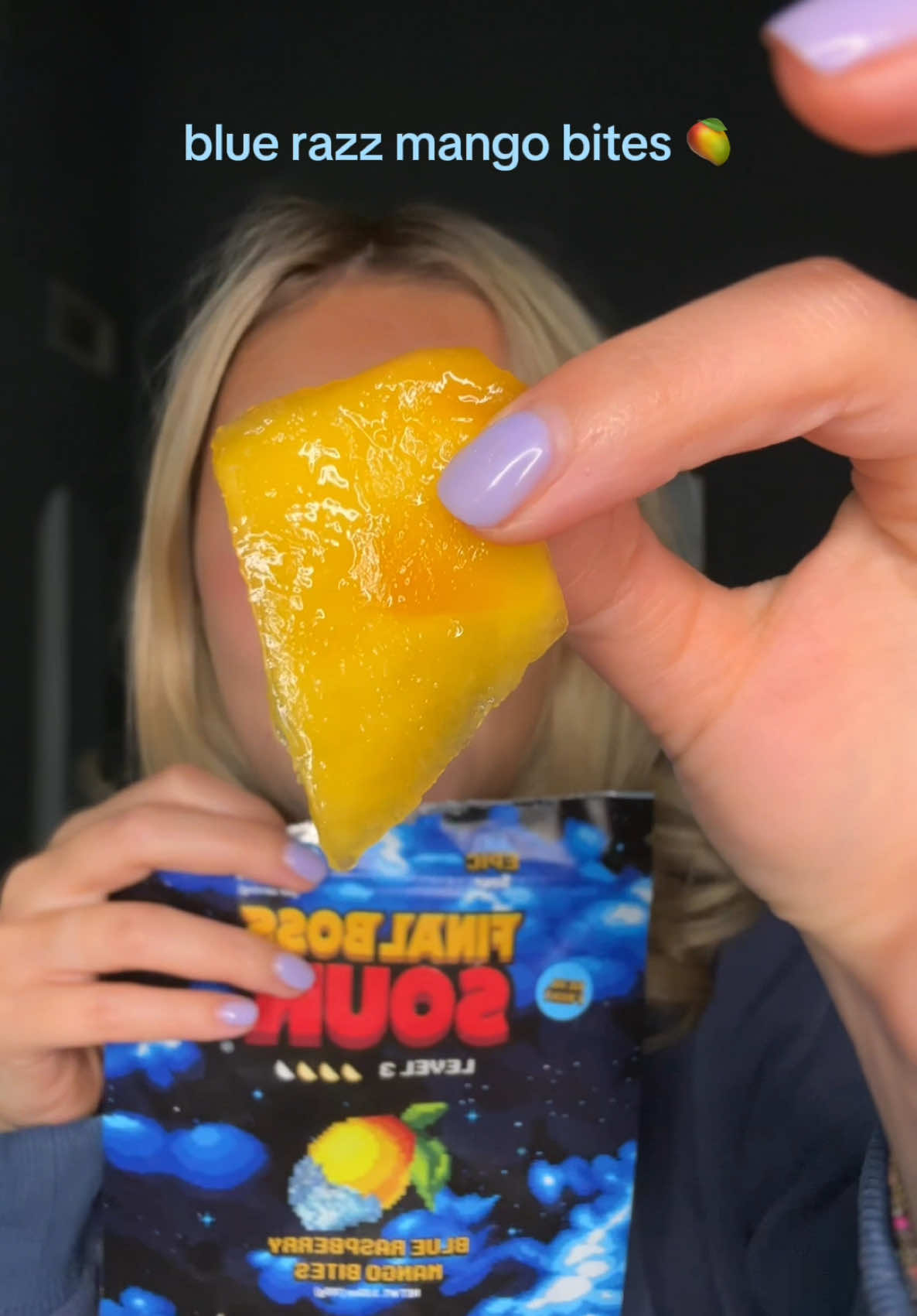 TikTok post by @abigailfeehls for Final Boss Sour. Caption reads: [...] that tastes like sour candy 🥭✨🍬🩷....