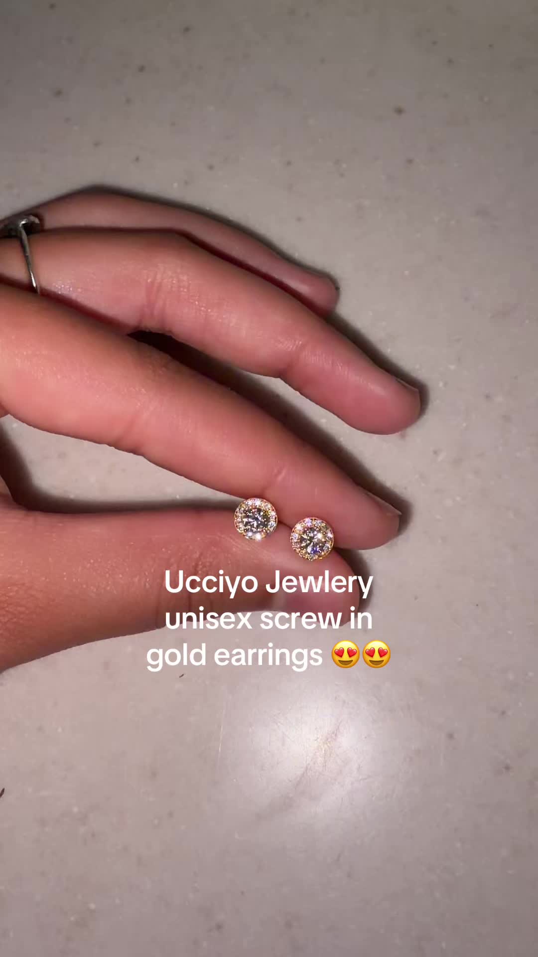 TikTok post by @fyeslimer for Ucciyo Brand. Caption reads: #fyp #earrings #gold @Ucciyo Jewelry-USA.