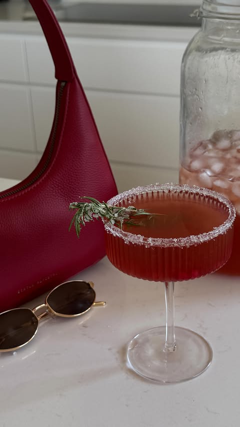 Instagram post by @coconutandbliss for Status Anxiety. Caption reads: Christmas pomegranate margarita🍹🎄 - the easiest....