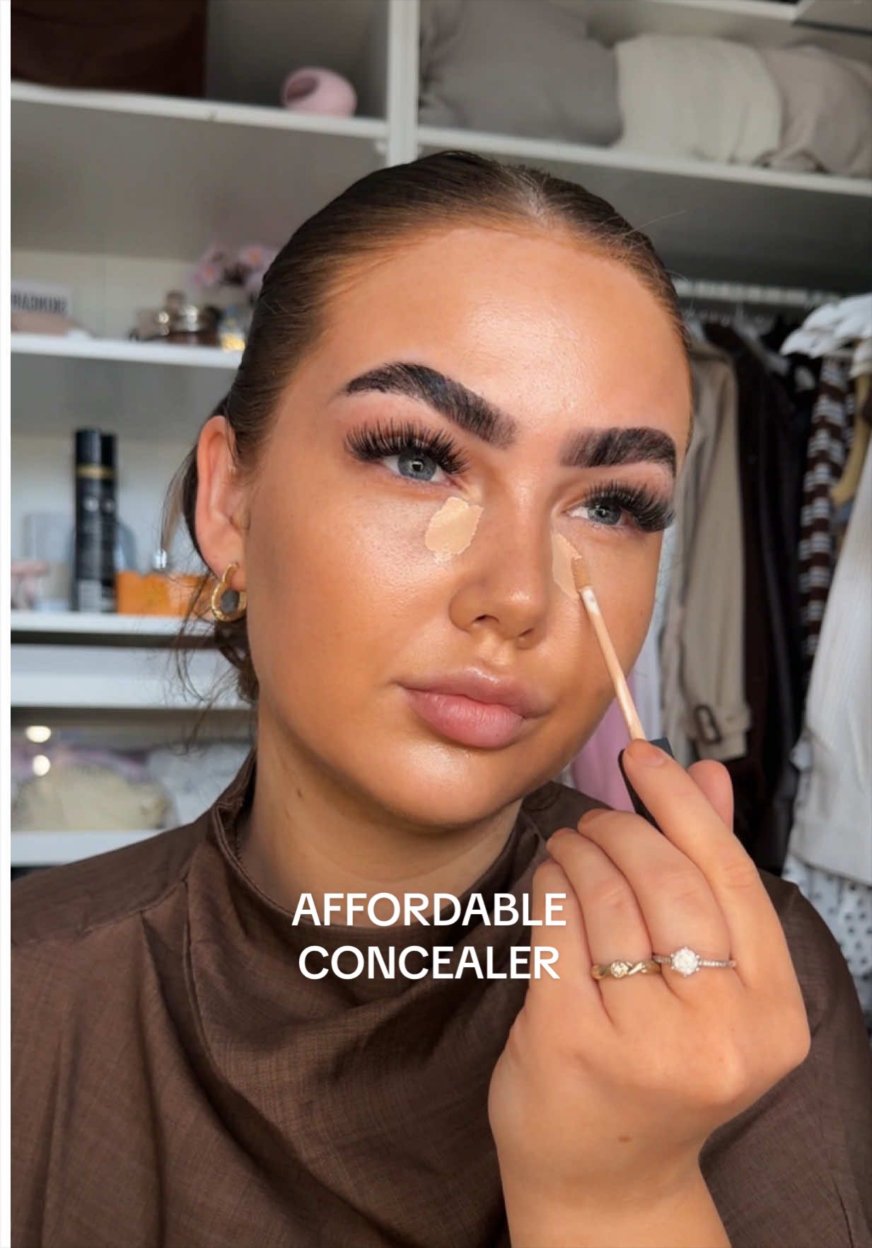 TikTok post by an influencer for MCoBeauty. Caption reads: [...] my everyday concealer 🤩 @MCoBeauty UK....