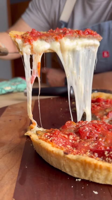 Instagram post by @mybizzykitchen for Lou Malnati's. Caption reads: If that cheese pull doesn’t convince you, I don’t....