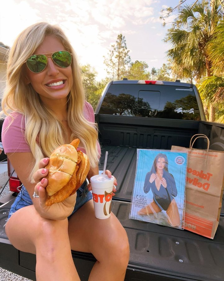 Instagram post by @britt_fishing for Hooters. Caption reads: [...] eating a Buffalo Chicken Sandwich from....