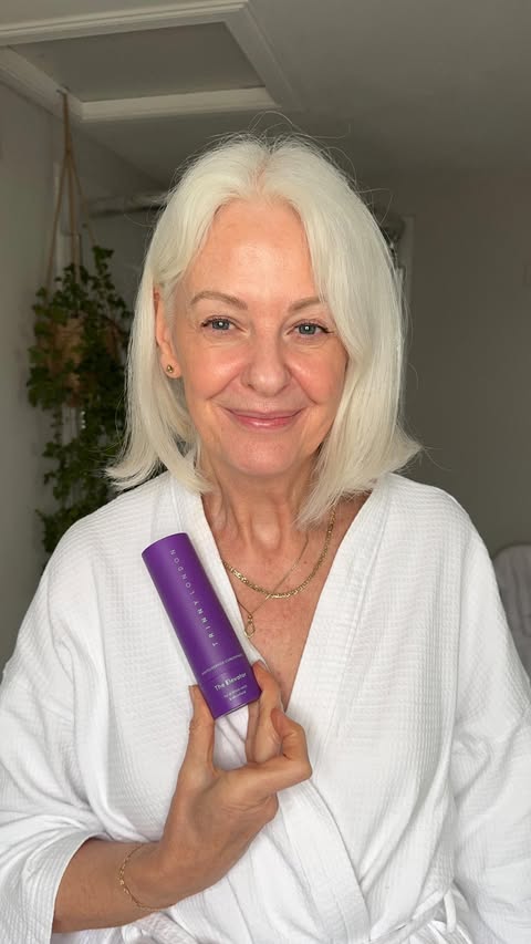 Instagram post by @embracingfifty for Trinny London. Caption reads: Ad Giving a little love to my neck and décolleté....