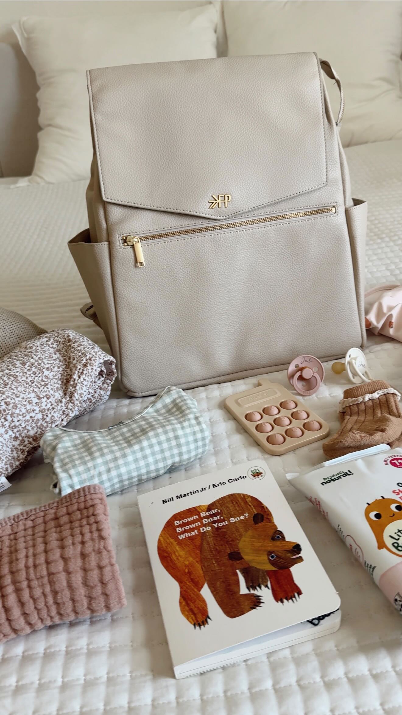 Instagram post by @dianakruegs for Freshly Picked. Caption reads: my diaper bag essentials as a first time mom to a....
