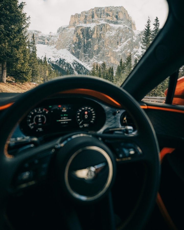 Instagram post by @opticalwander for Bentley Motors. Caption reads: The perfect road trip. Explore beautiful....