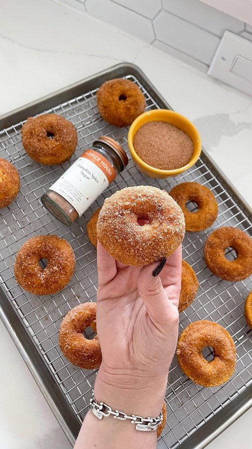 Instagram post by @itsbrunchoklock for The Spice House. Caption reads: baked pumpkin spice sugar donuts ✨🧡 when I tell....