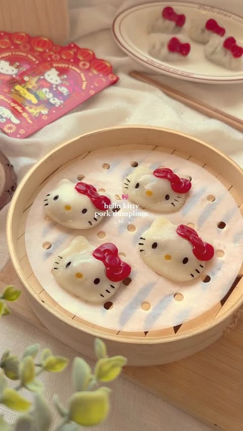Instagram post by @may.kawaiikitchen for Hello Kitty. Caption reads: Hello Kitty Pork Dumplings 🥟 I’m celebrating....