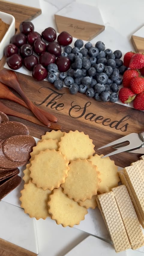 Instagram post by @ourhomerenovationsss for Callie Gifts. Caption reads: [...] perfect board for all my snack plates....