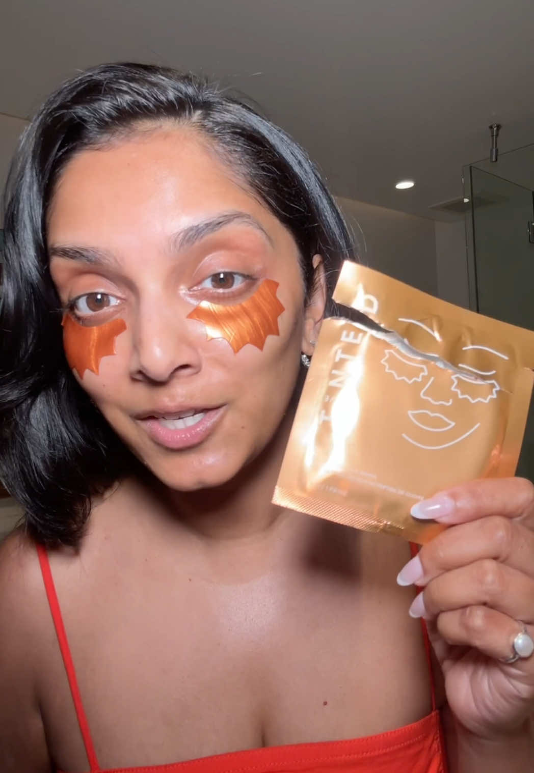 TikTok post by @deepica for LIVE TINTED. Caption reads: [...] and smoothing my under eyes. @Live Tinted 🧡.