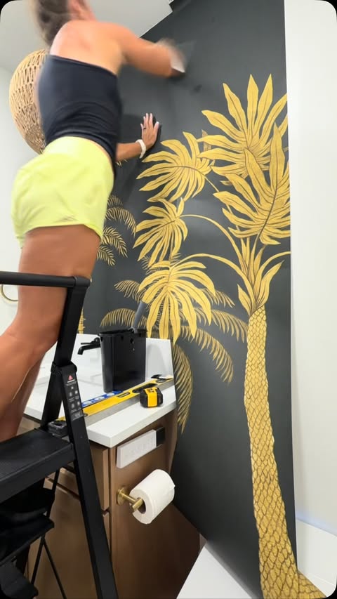 Instagram post by @eastcoastfloridadiy for Rebel Walls. Caption reads: Ad @rebelwalls Golden Palms, Black One little....