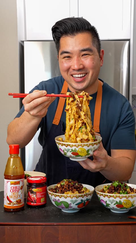 Instagram post by @cj.eats_ for Lee Kum Kee. Caption reads: [...] Spicy Chili Oil Garlic Noodles using....