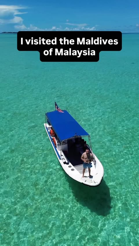 Instagram post by @authentic_traveling for AirAsia. Caption reads: [...] Malaysia! Paid Partnership with @flyairasia....