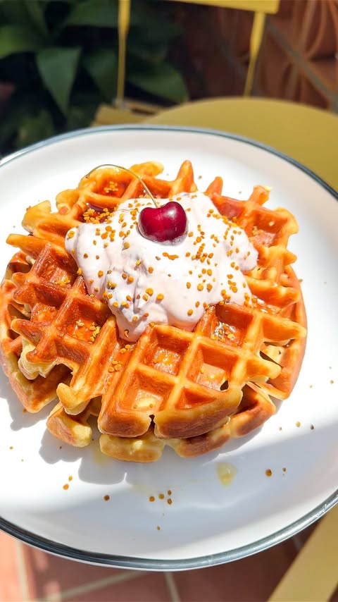 Instagram post by @noshwithtash for Chobani. Caption reads: [...] I’m making Belgian-style waffles with....