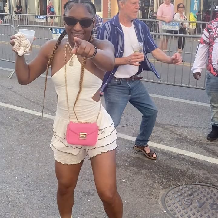 Instagram post by @themisadventuresofteamaj for Visit New Orleans. Caption reads: Always so good to see @secondlineshorty_ .  French....