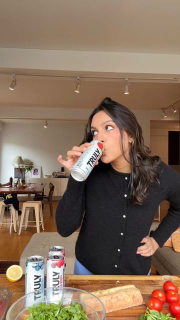 Instagram post by @realdeepa for Truly Hard Seltzer. Caption reads: a very silly afternoon made even more fun with a....