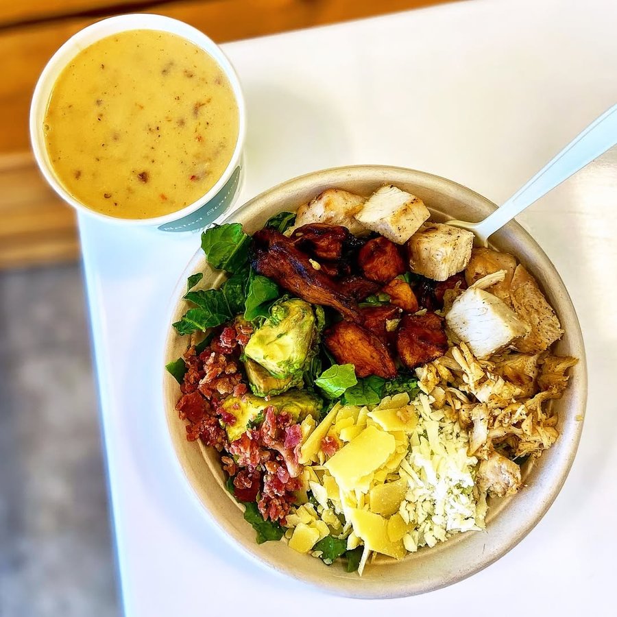 Instagram post by @lynniethefoodie for Salad Station. Caption reads: [...] my fix of greens and protein from....