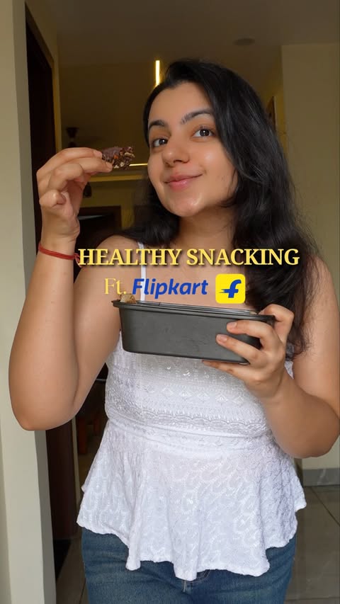 Instagram post by @thevegetarianladki for Flipkart Lifestyle. Caption reads: Crunchy, chocolatey, and packed with oats, seeds &....