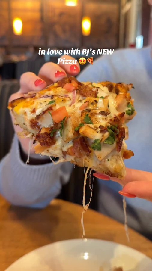 Instagram post by an influencer for BJ's Restaurant & Brewhouse. Caption reads: Can confirm... BJ’s new pizza is the best thing....