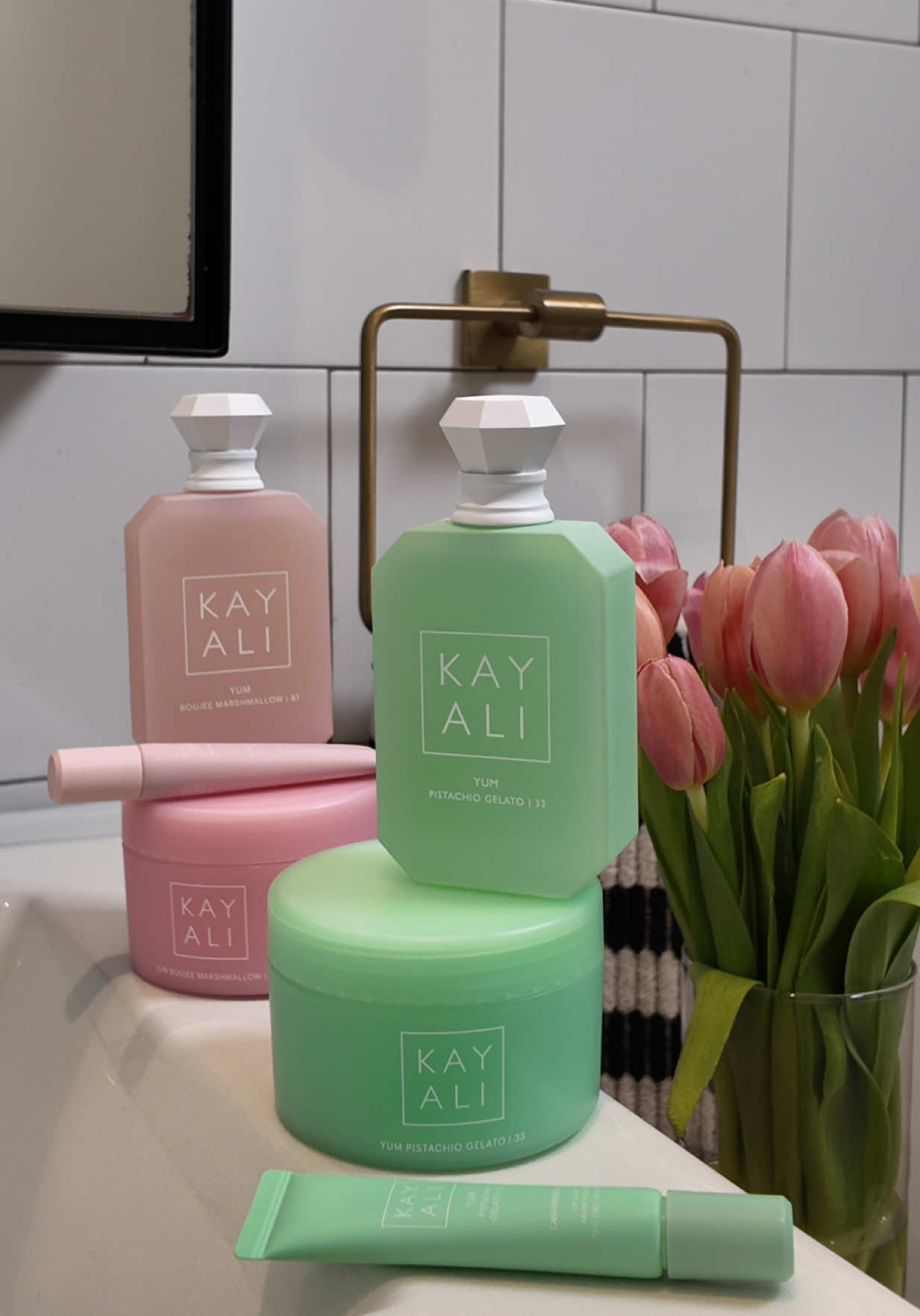 TikTok post by @scotfknlouie for Kayali. Caption reads: Stay at home Diva Glam with @KAYALI YUM lip & body....